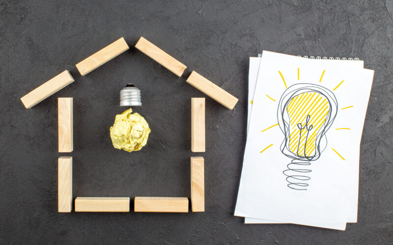 top-view-idealight-bulb-house-shaped-wood-blocks-idealight-bulb-drawing-notepad-black